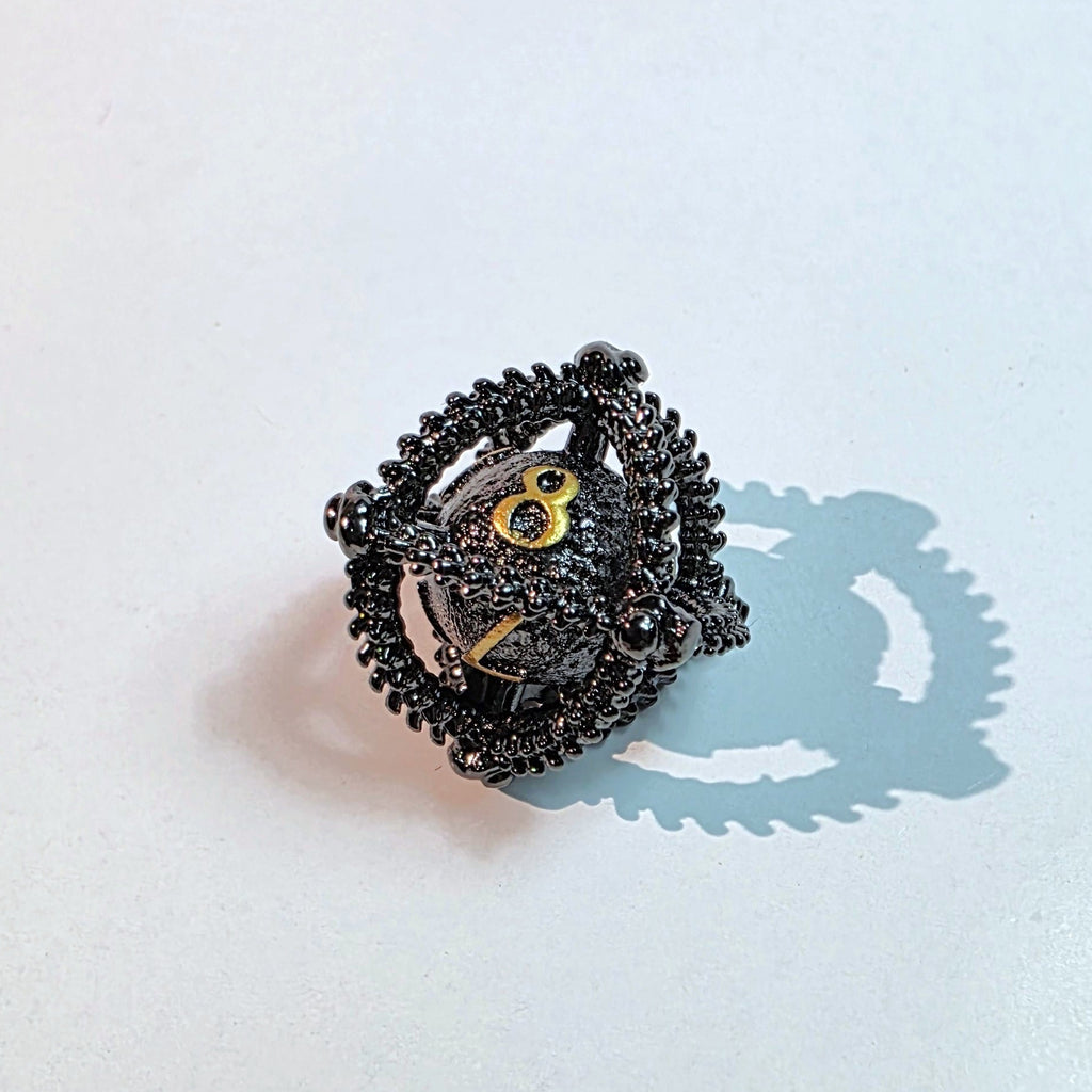 Set de dados de metal hueco oro negro con diseño de huevo de dragón