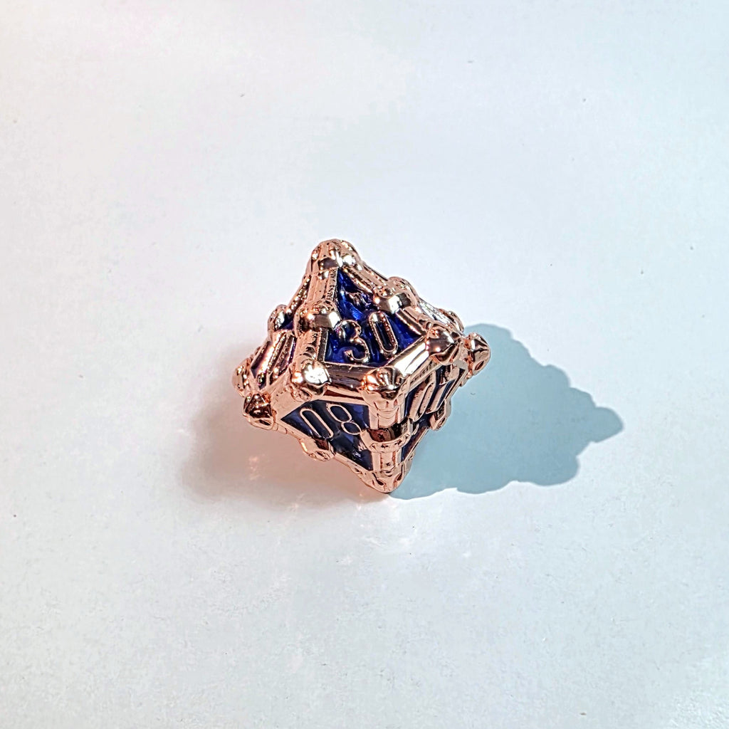 Juego de dados de metal sólido Deathmask en color azul cobrizo